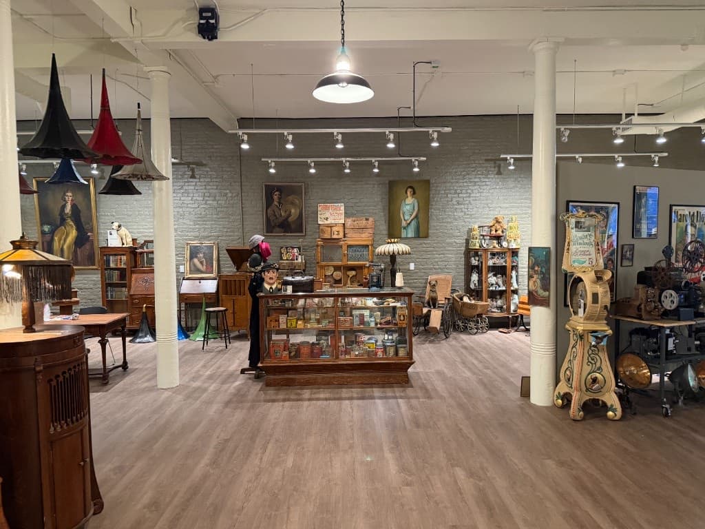 Paintings and antique objects arranged throughout the Beautiful Things gallery interior.